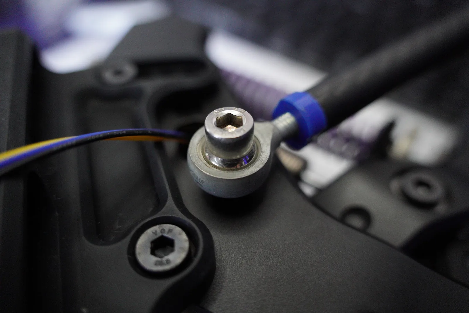Close-up of a rod end and bolt on a PurrPRO prototype